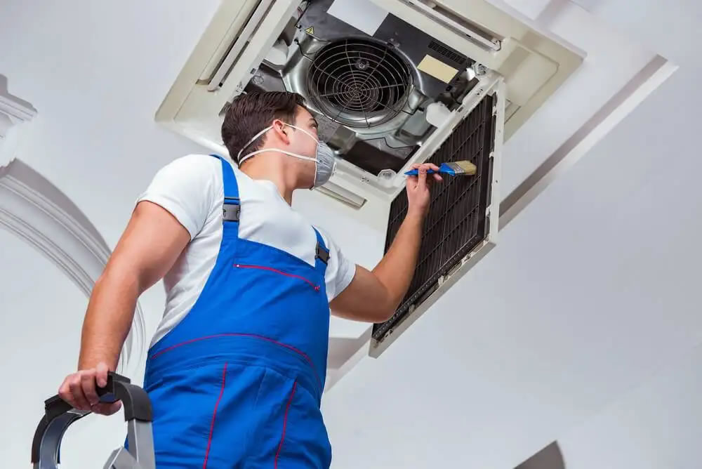 photo of A/C duct being cleaned 