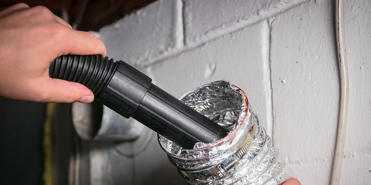 photo of dryer vent being cleaned 